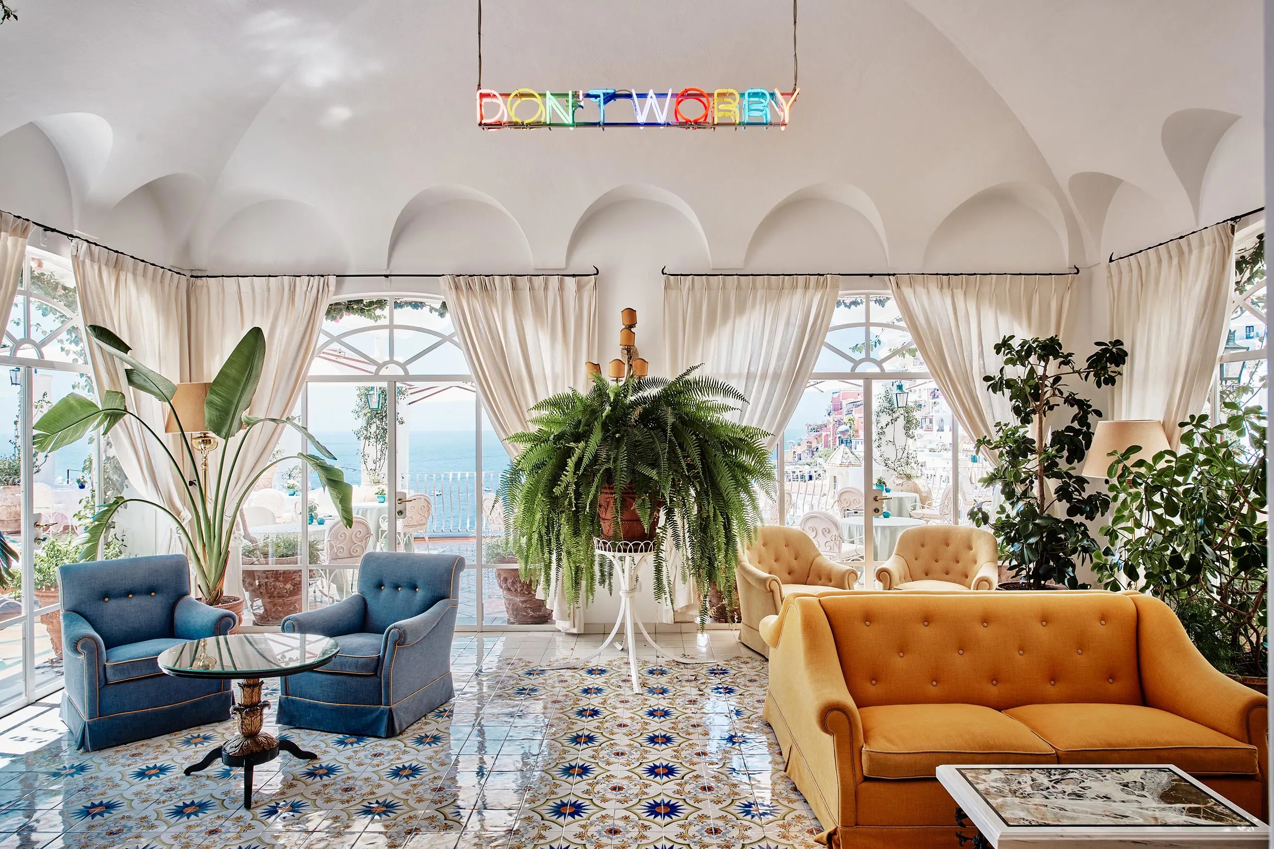 The terrace and pool of Le Sirenuse in Positano, overlooking the Amalfi Coast