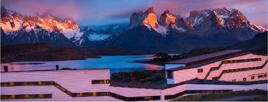 Explora Patagonia — a sleek ribbon of lenga wood and glass on the shores of Lake Pehoé, inside Torres del Paine