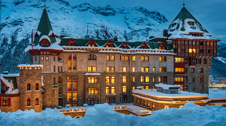 The iconic tower of Badrutt's Palace Hotel above the frozen lake of St. Moritz