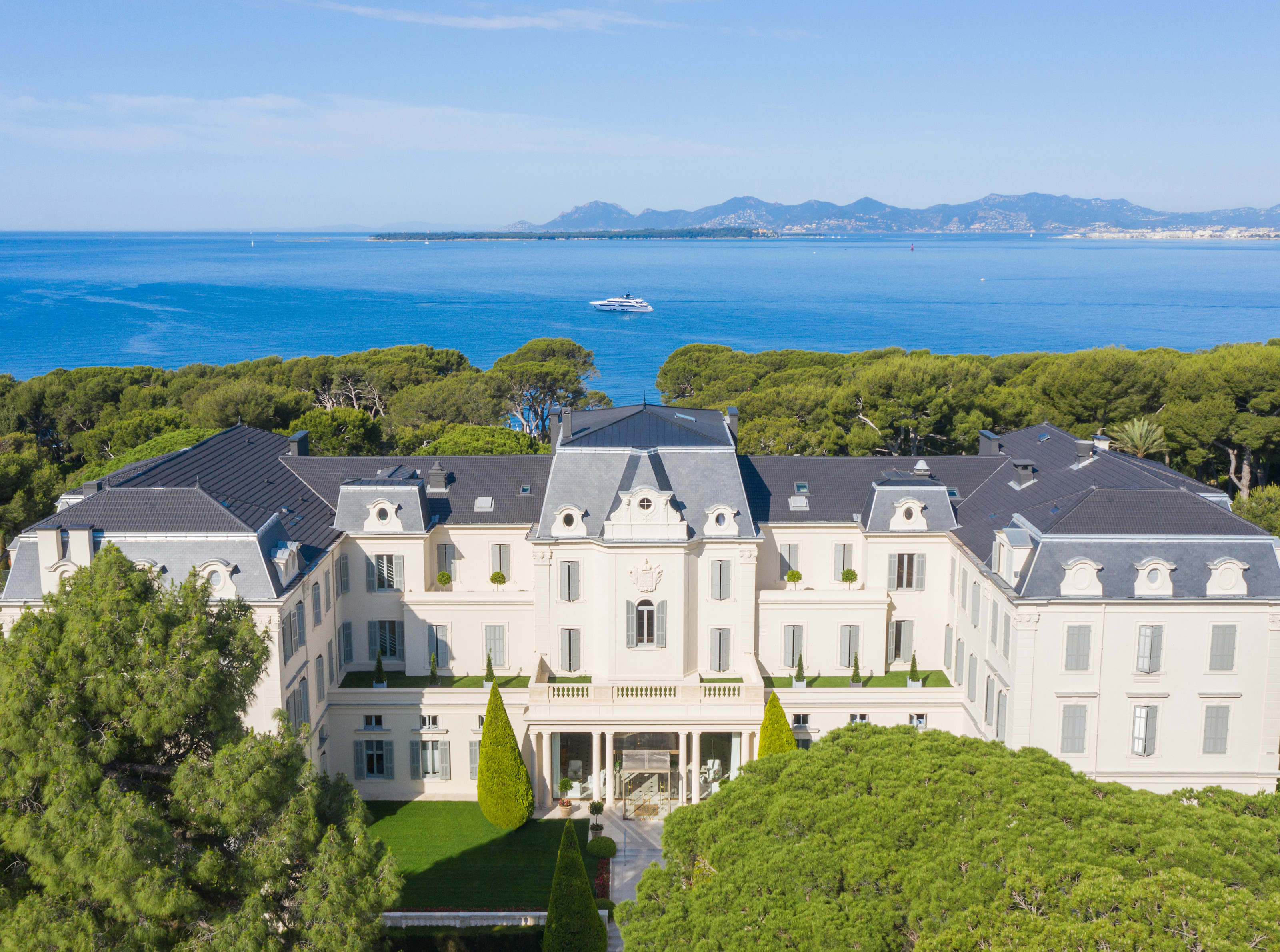 The iconic white facade of Hôtel du Cap-Eden-Roc above the Mediterranean at Antibes