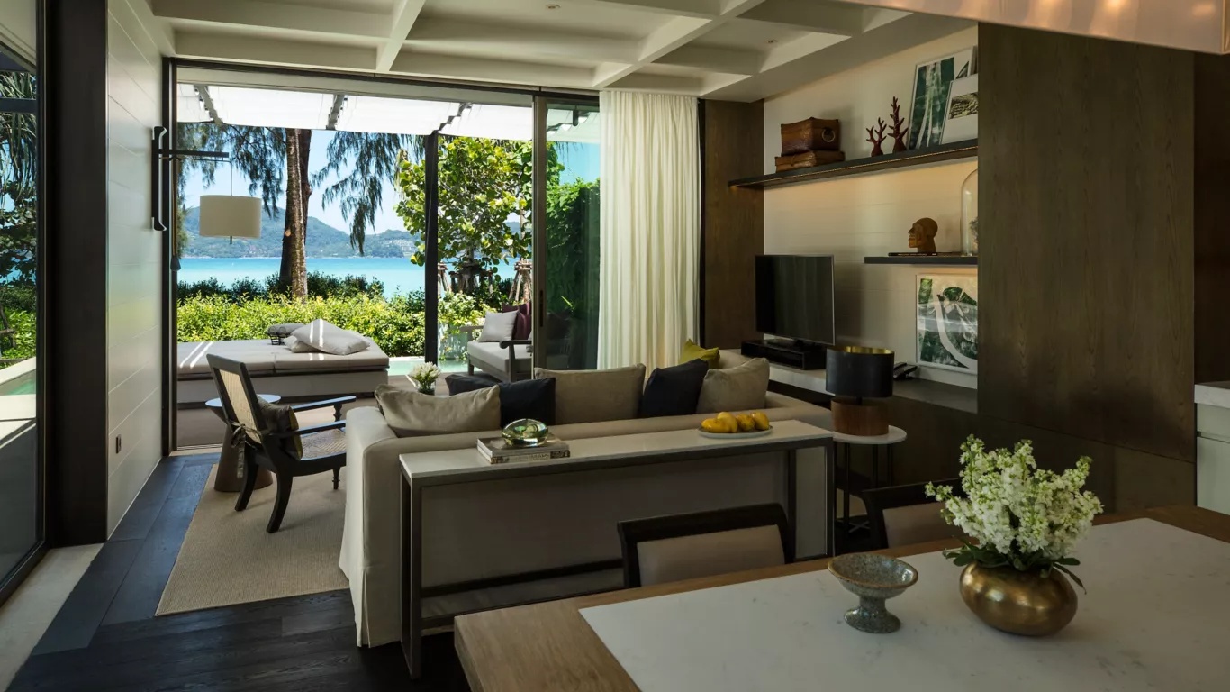 The clifftop villas and infinity pool of Rosewood Phuket above Emerald Bay